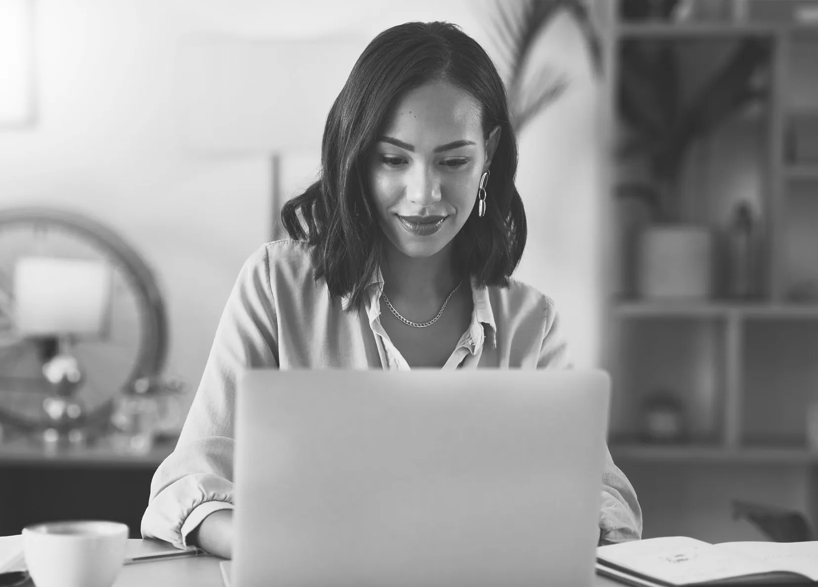 A person looks at their laptop