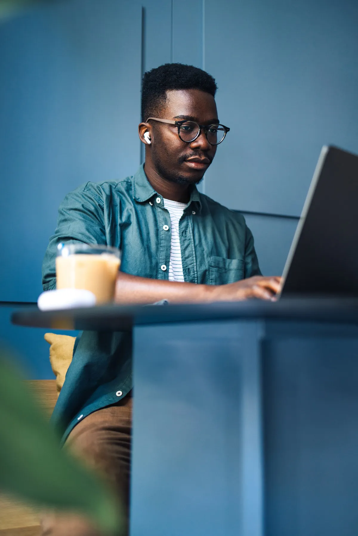 An person looks at their laptop