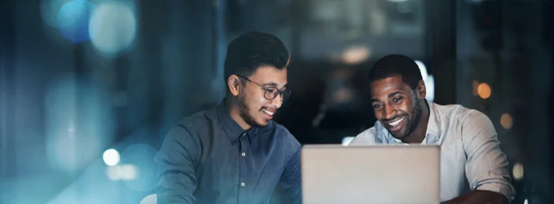 A businessperson gestures to a colleague